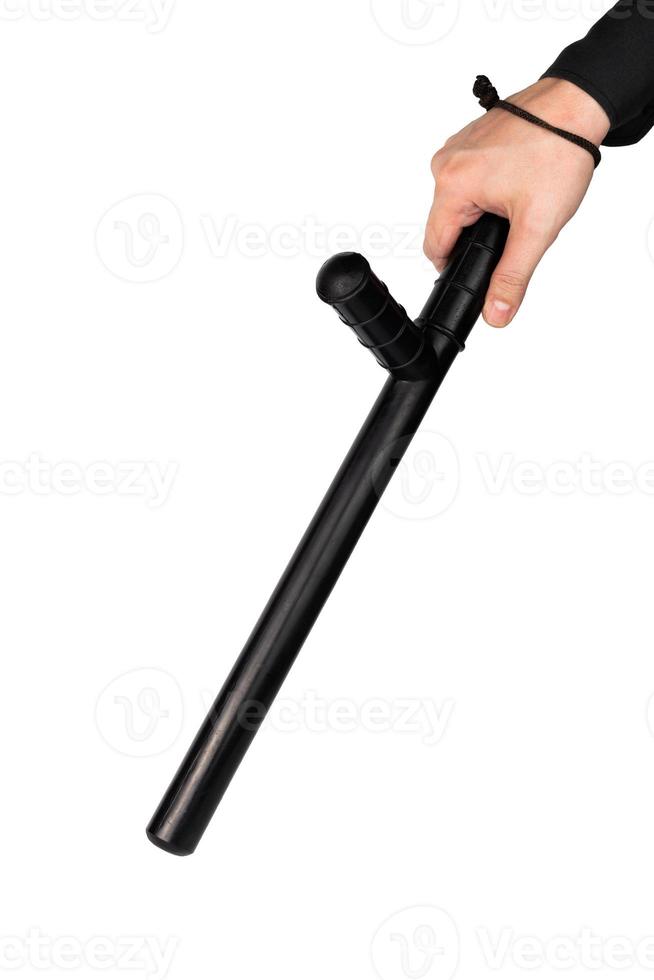 hand in black shirt with black rubber police baton isolated on white background photo