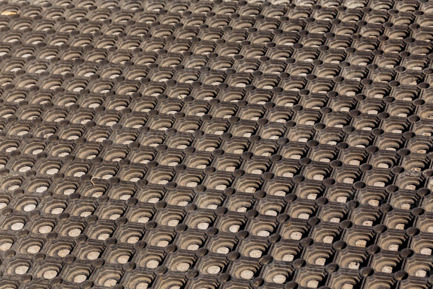texture and background of used dusty cellular rubber floor mat photo