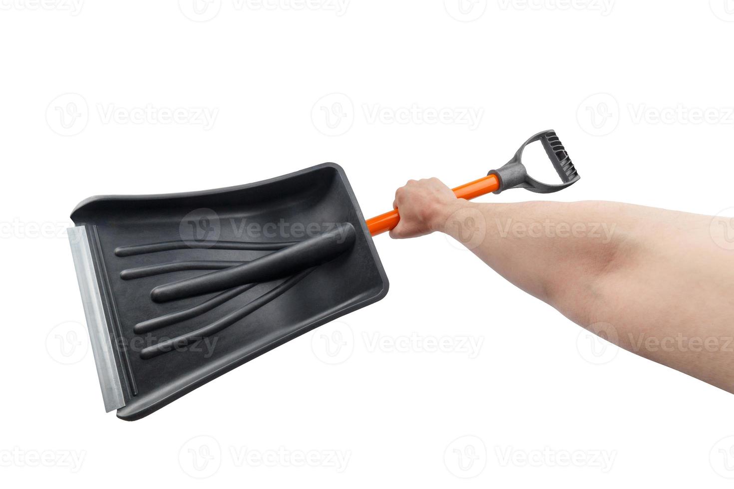 white hand holding small black plastic snow shovel, isolated photo