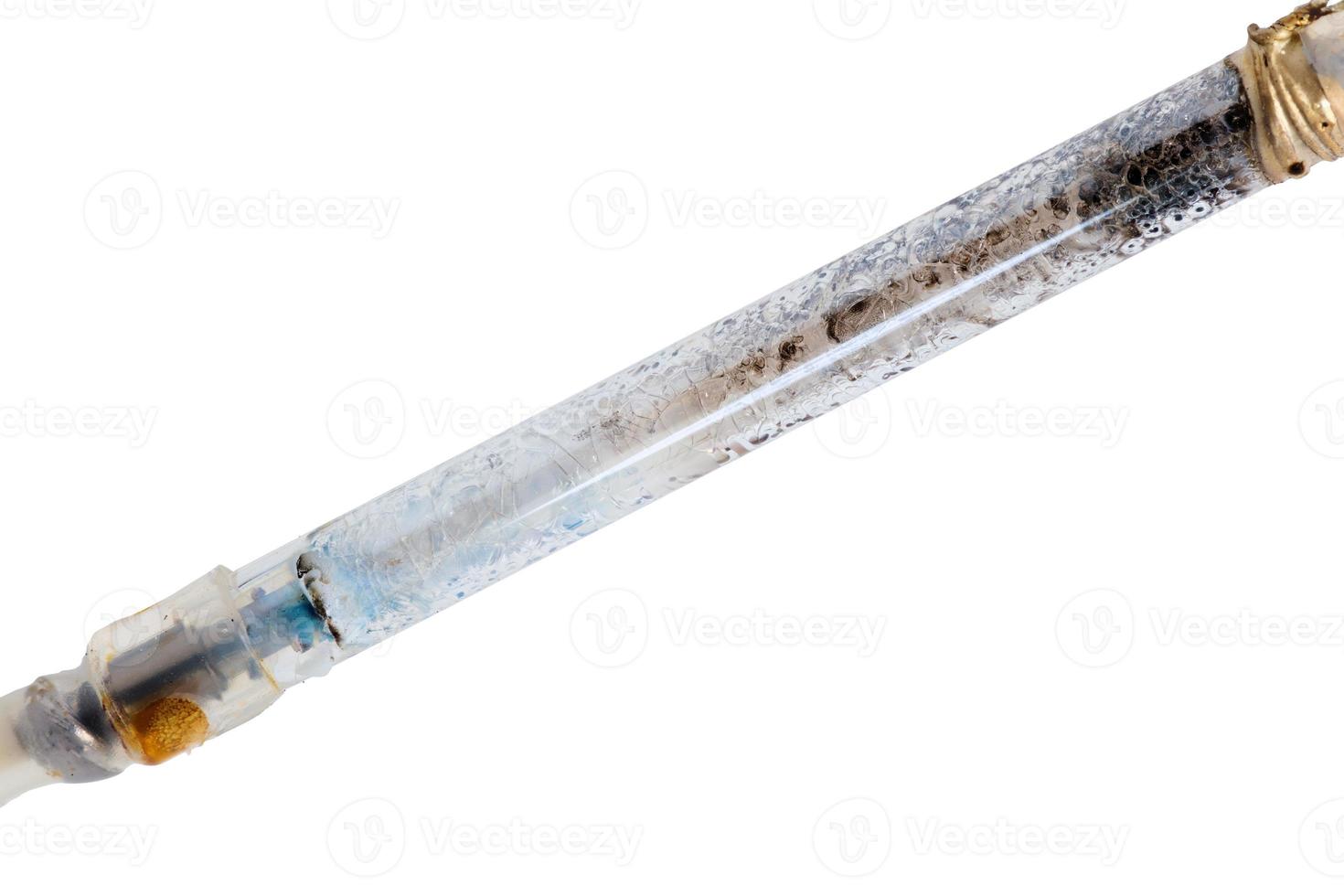 broken xenon flashgun lamp closeup isolated on white background photo
