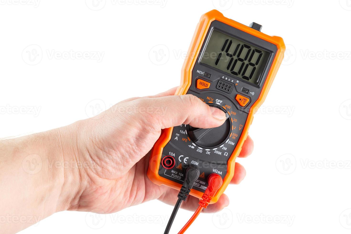 digit 1488 on lcd screen of digital electrical multimeter in left hand, isolated on white background photo