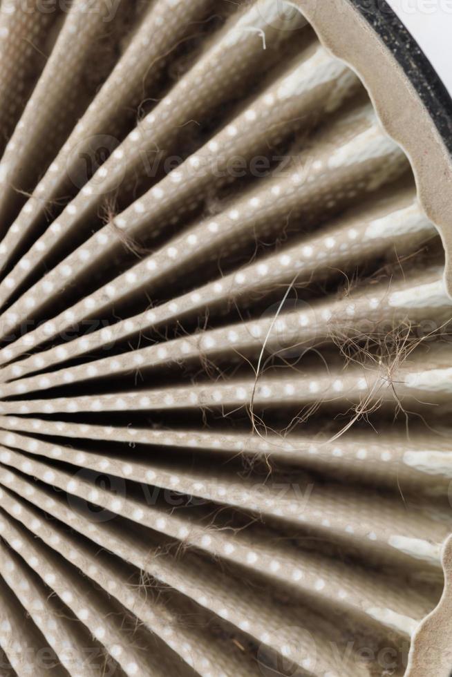 dust, hairs and fur on radial HEPA filter, close-up with selective focus photo