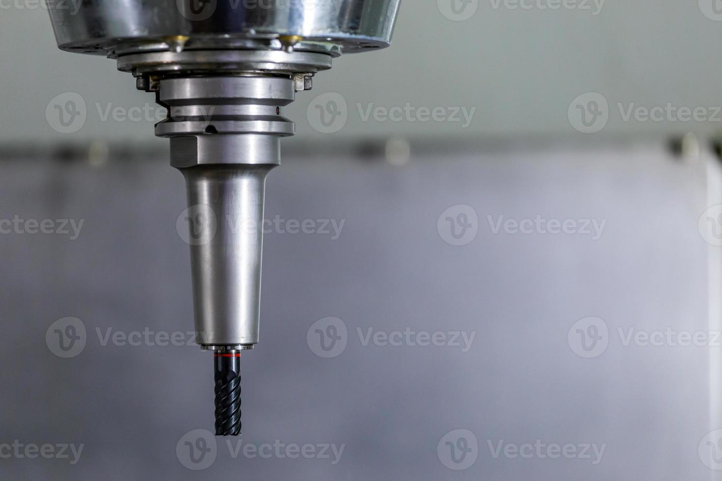 carbide mill in slim hydraulic chuck in vertical cnc milling machine photo