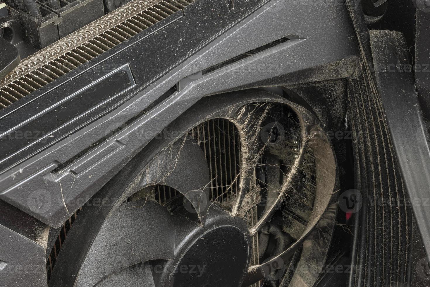 dusty black pro gaming graphic card fan blades with dust, airborne fur and hairs close-up photo