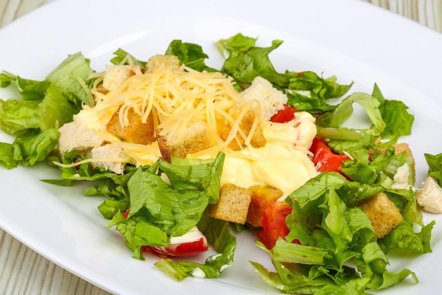 Caesar salad on the plate photo