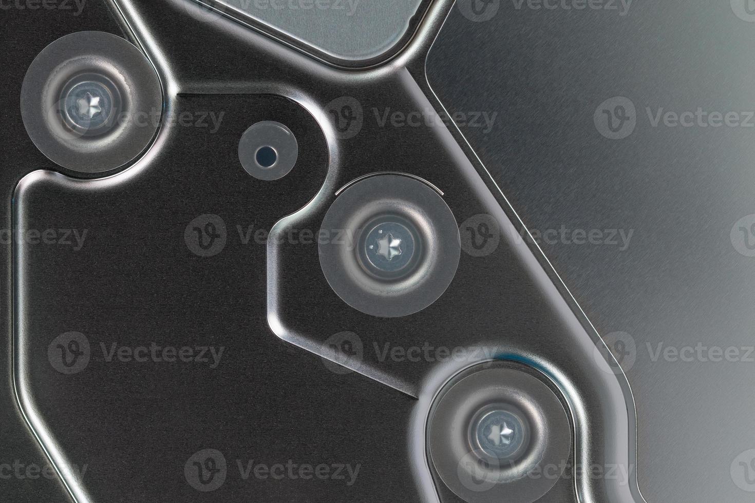 abstract metal tech background of shiny steel panel of computer hard disk drive photo