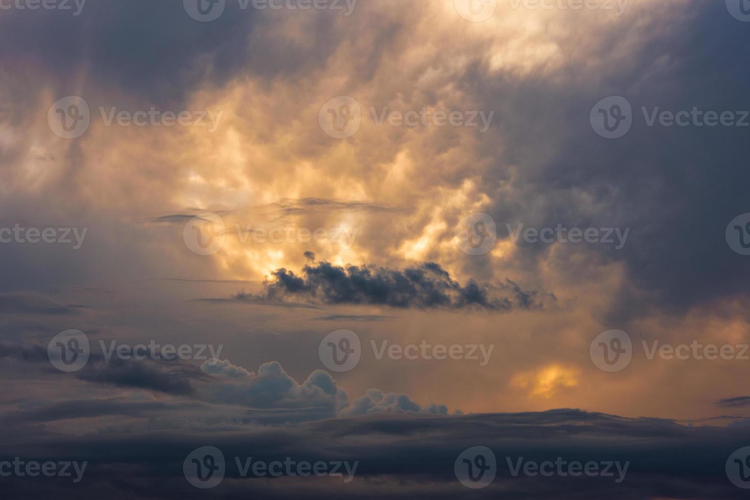 dramatic evening clouds at summer sunset photo