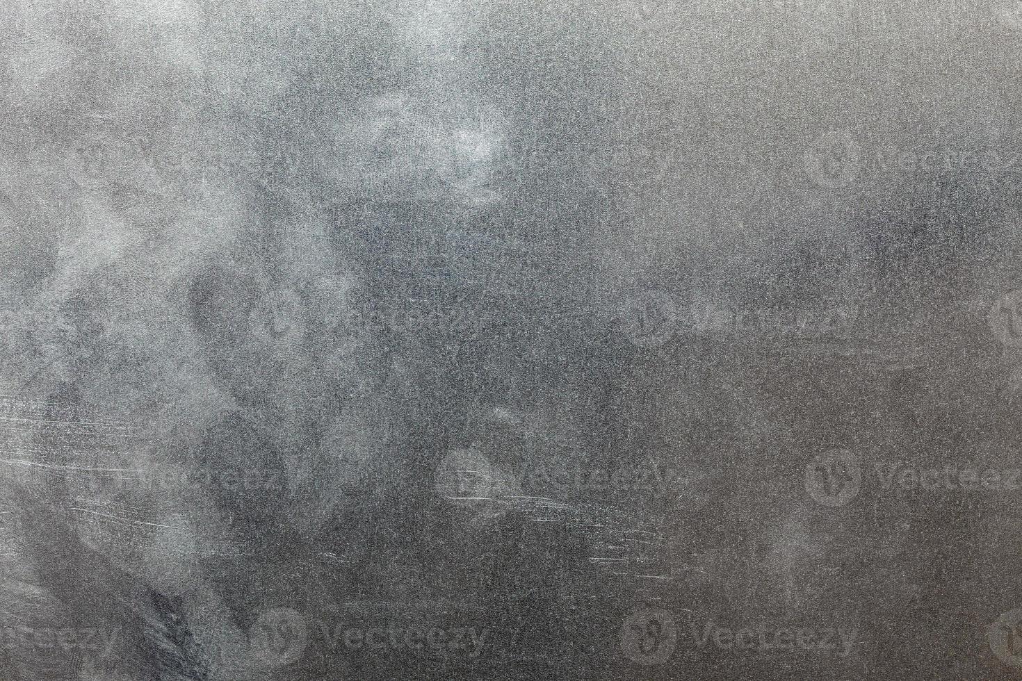 Uncoated flat cold rolled steel sheet surface with finger prints and hand fat dirt. Close-up in directly above composition. photo
