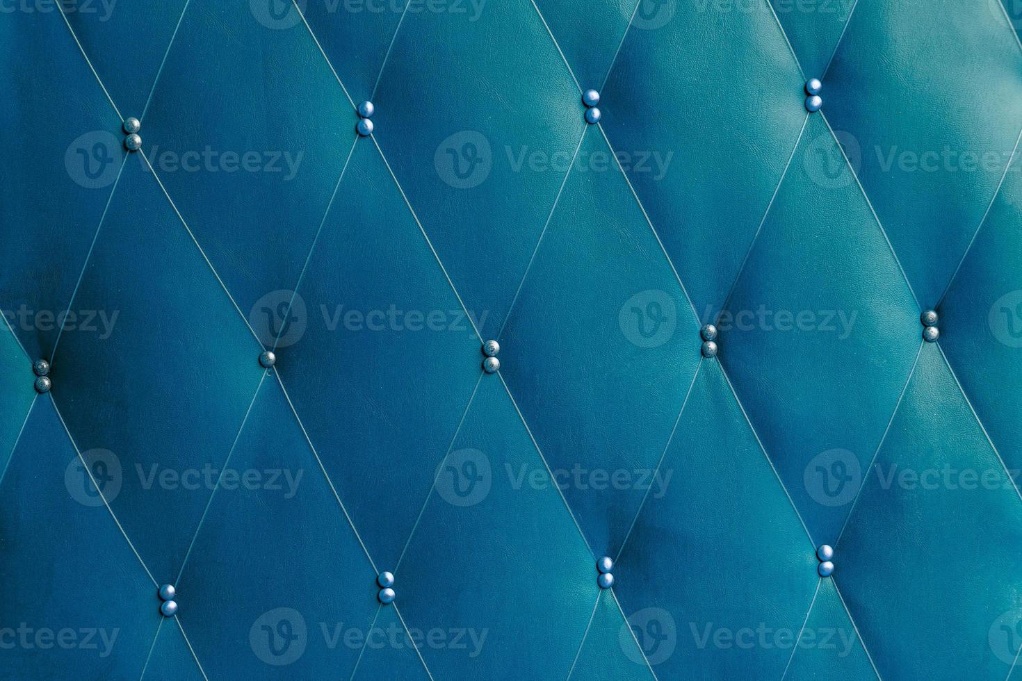 Soviet classic blue dermantine front door with a banner of fishing line and nails - full frame background and texture photo