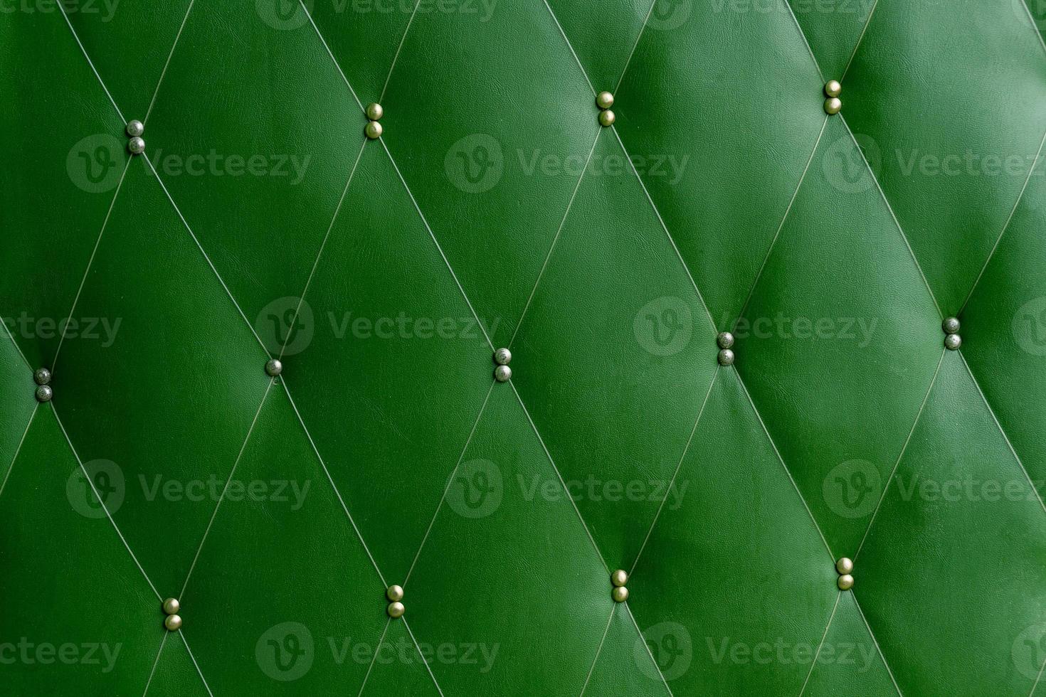 Soviet soft green dermantine front door with a banner of fishing line and nails - full frame background and texture photo