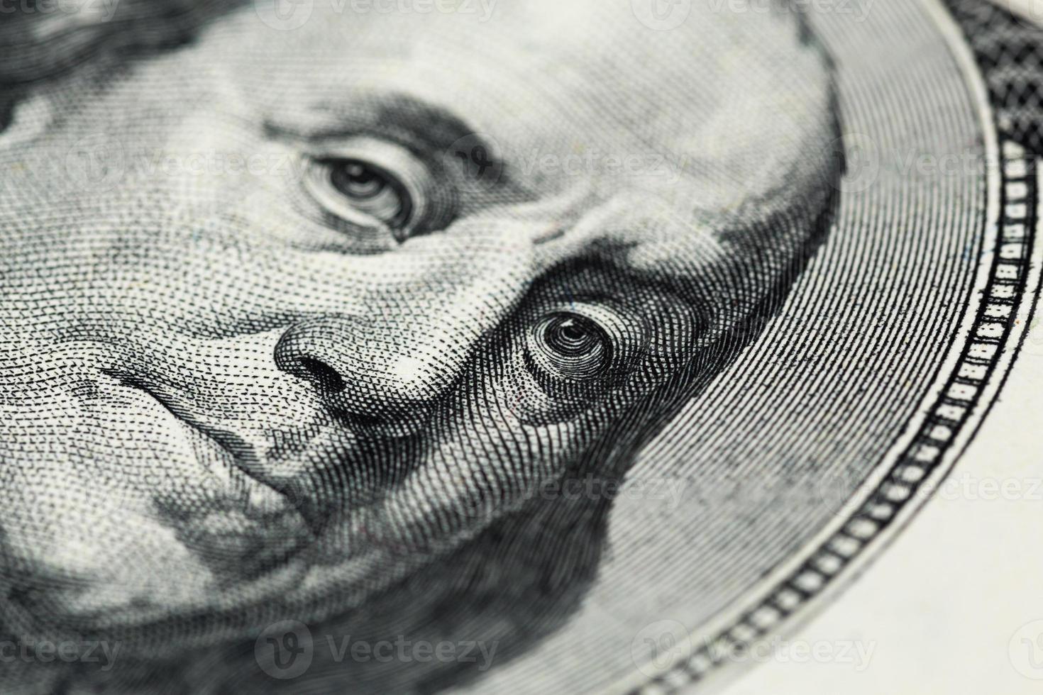 A close view of boring portrait of Ben Franklin of old one hundred us dollar photo