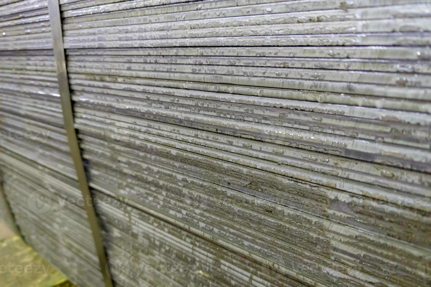 stack of mild steel sheets, full-frame close-up view with selective focus photo