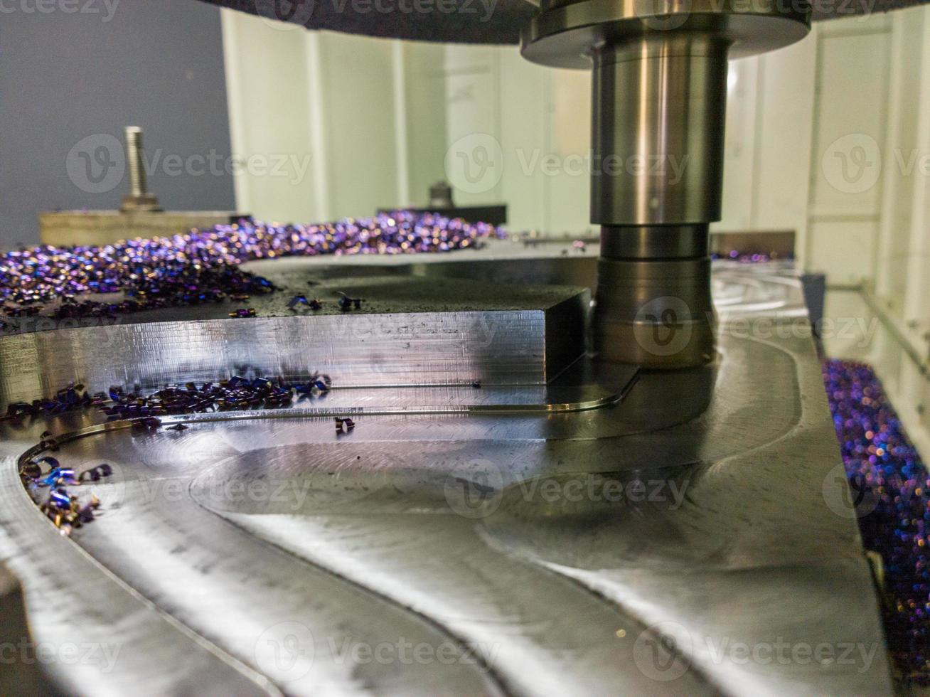 A process of cnc milling of lagre thick steel palte by curved trajectory, Selective focus with blur technique. photo