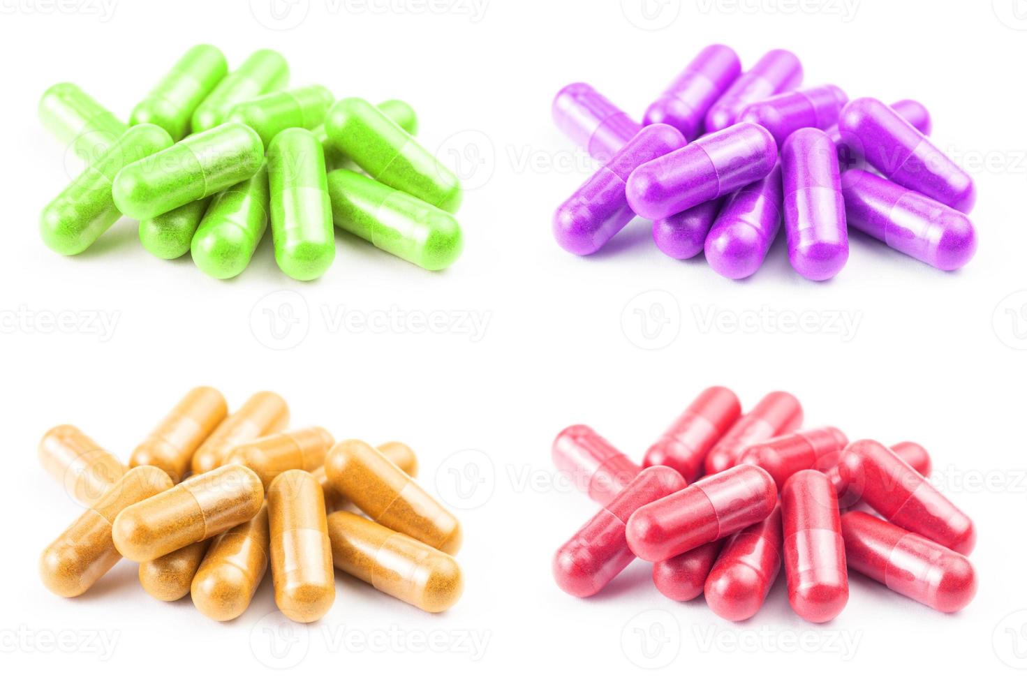 set of of colored organic capsules isolated on white background closeup with selective focus photo