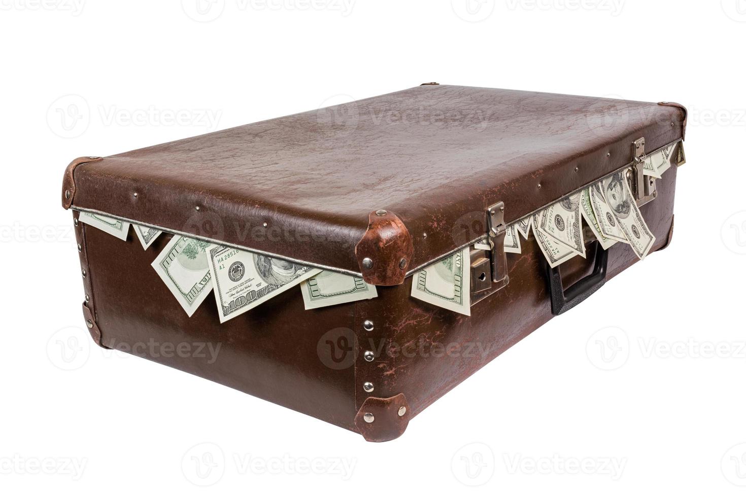 suitcase with sticking out dollar banknotes. Closed, laying on side and isolated photo