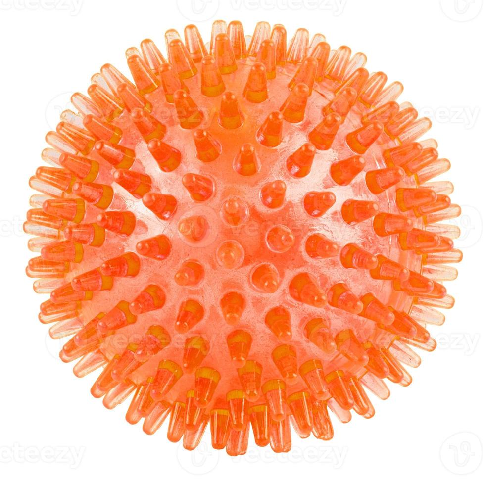 transparent orange spiked plastic ball isolated on white background - massager, dog toy and COVID-19 symbol photo
