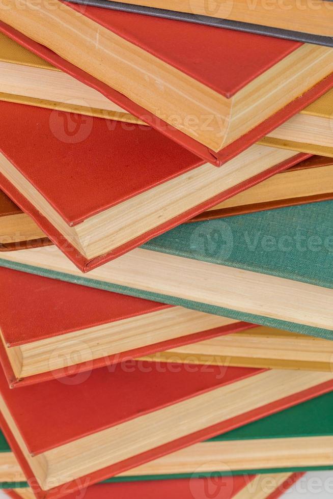abstract books background - old red and muted green ones in a vertical stack photo
