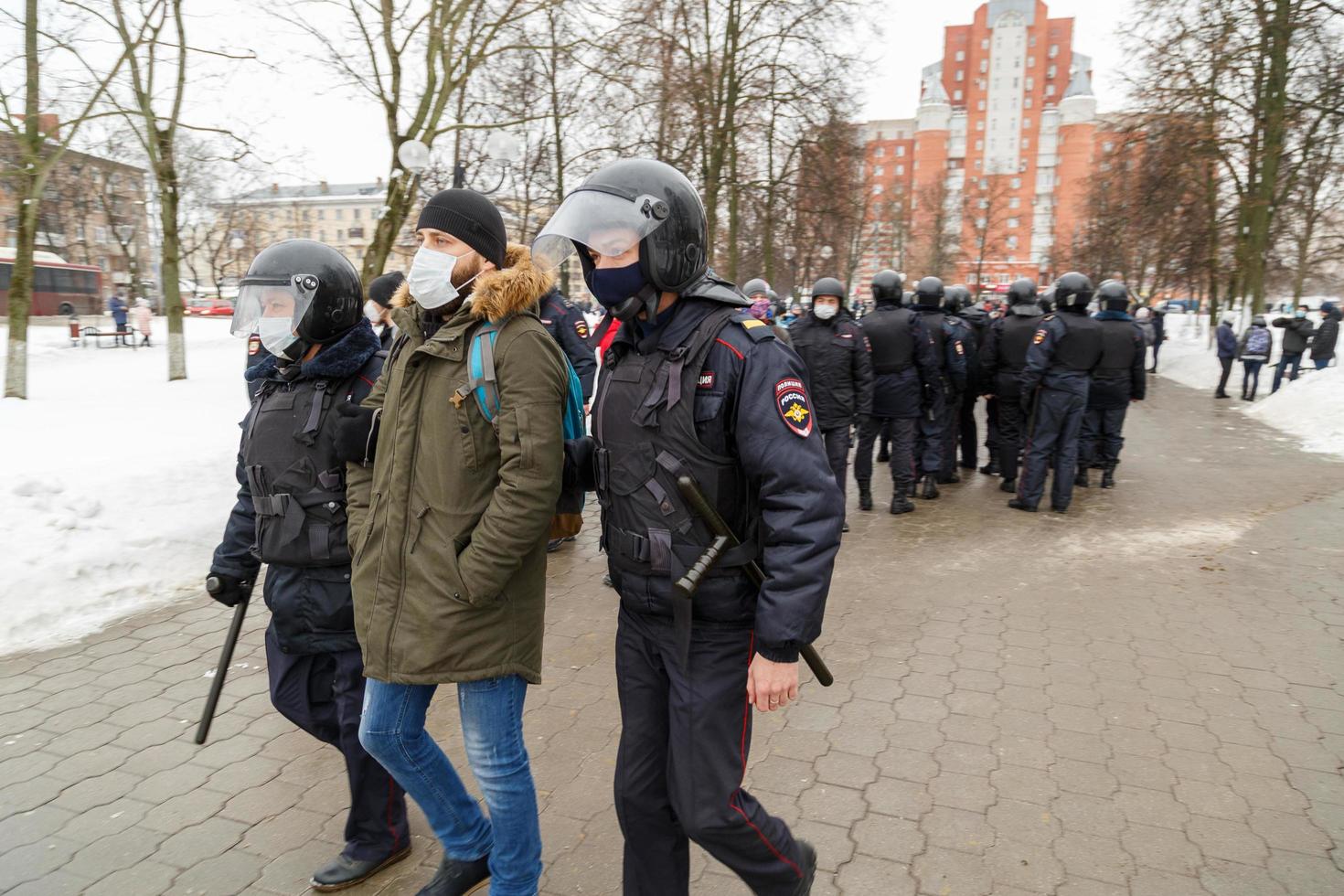 TULA, RUSSIA JANUARY 23, 2021 Public mass meeting in support of Alexei Navalny, police officers arresting male citizen. photo