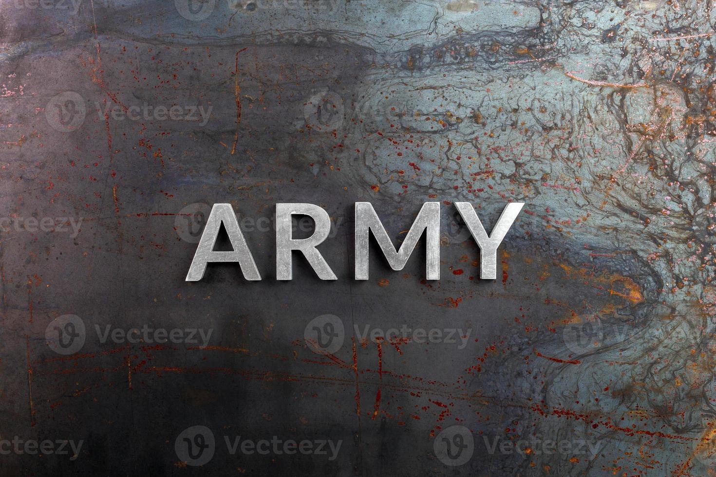 the word army laid with aluminium metal letters on rusted iron sheet surface photo