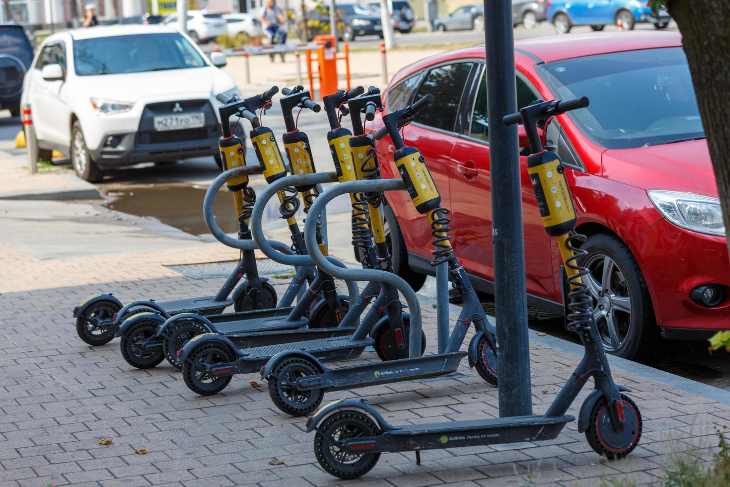 Tula, Russia August 2, 2021 Electric scooters for rent in the parking lot. Eco-friendly fransport for moving in city. photo