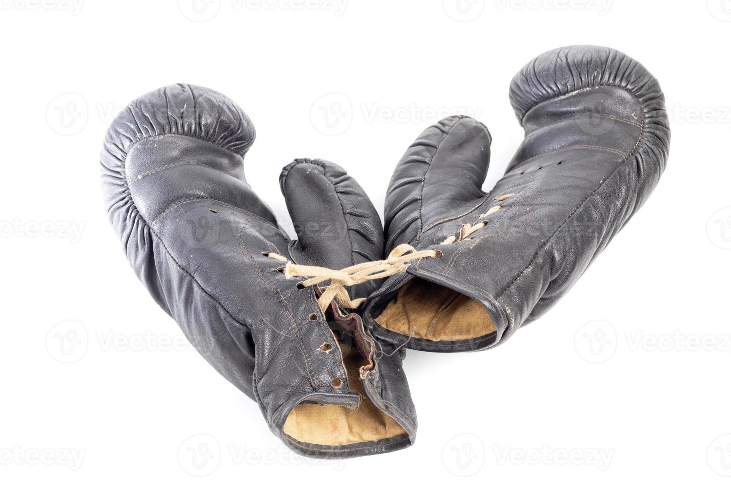 old black leather boxing gloves isolated on white background photo