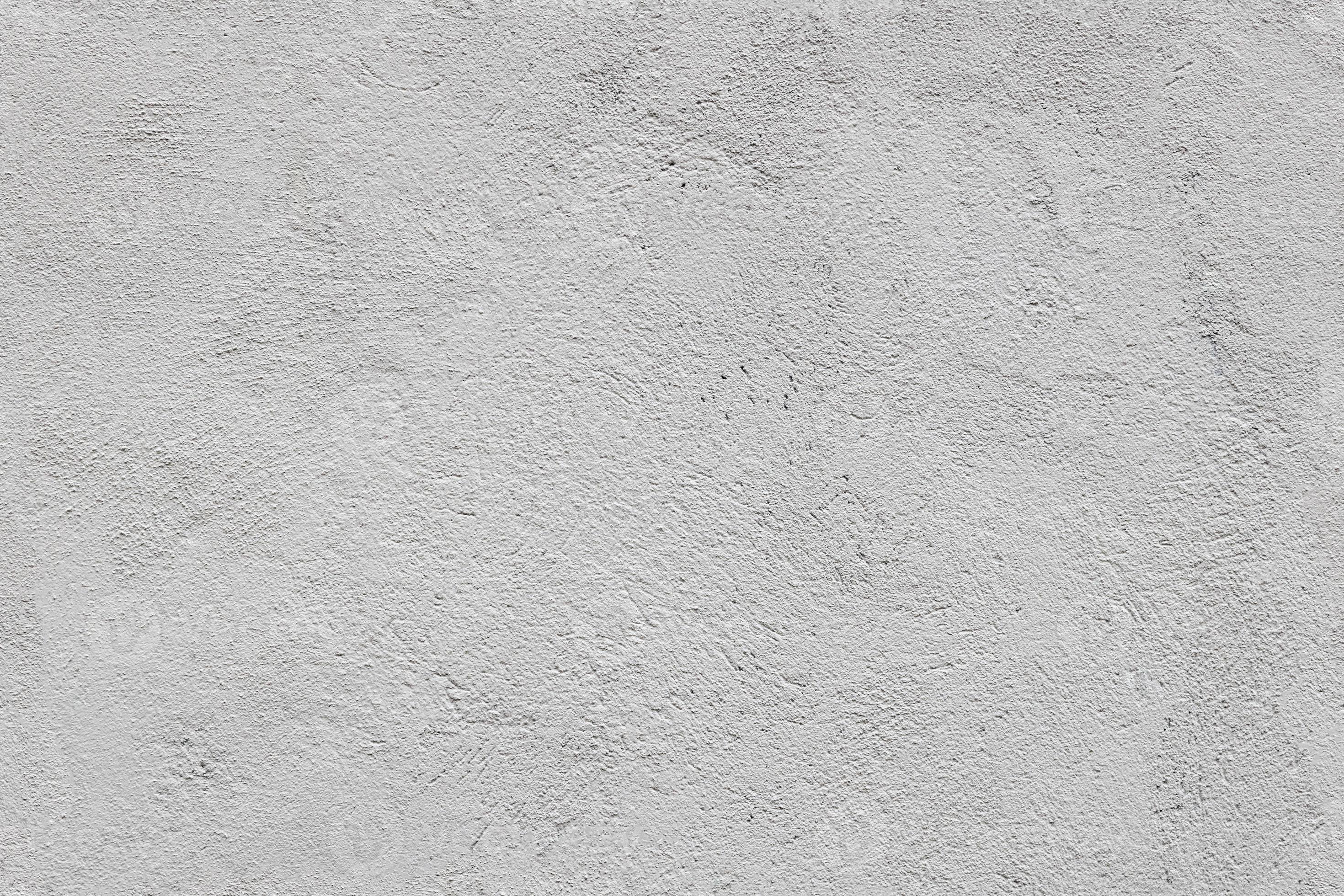 seamless texture and full frame background of rough grey plaster