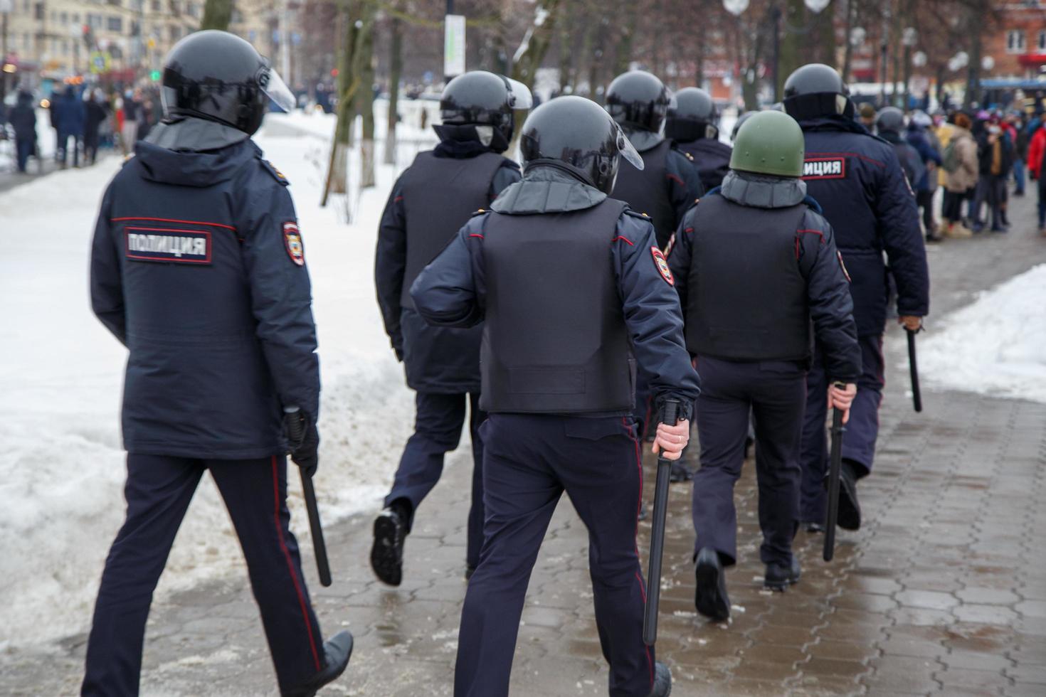 TULA, RUSSIA JANUARY 23, 2021 Public mass meeting in support of Alexei Navalny, group of police officers going to arrest protesters. photo
