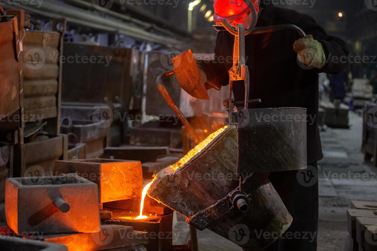 Industrial chill casting. The process of for filling out mold with molten metal. photo