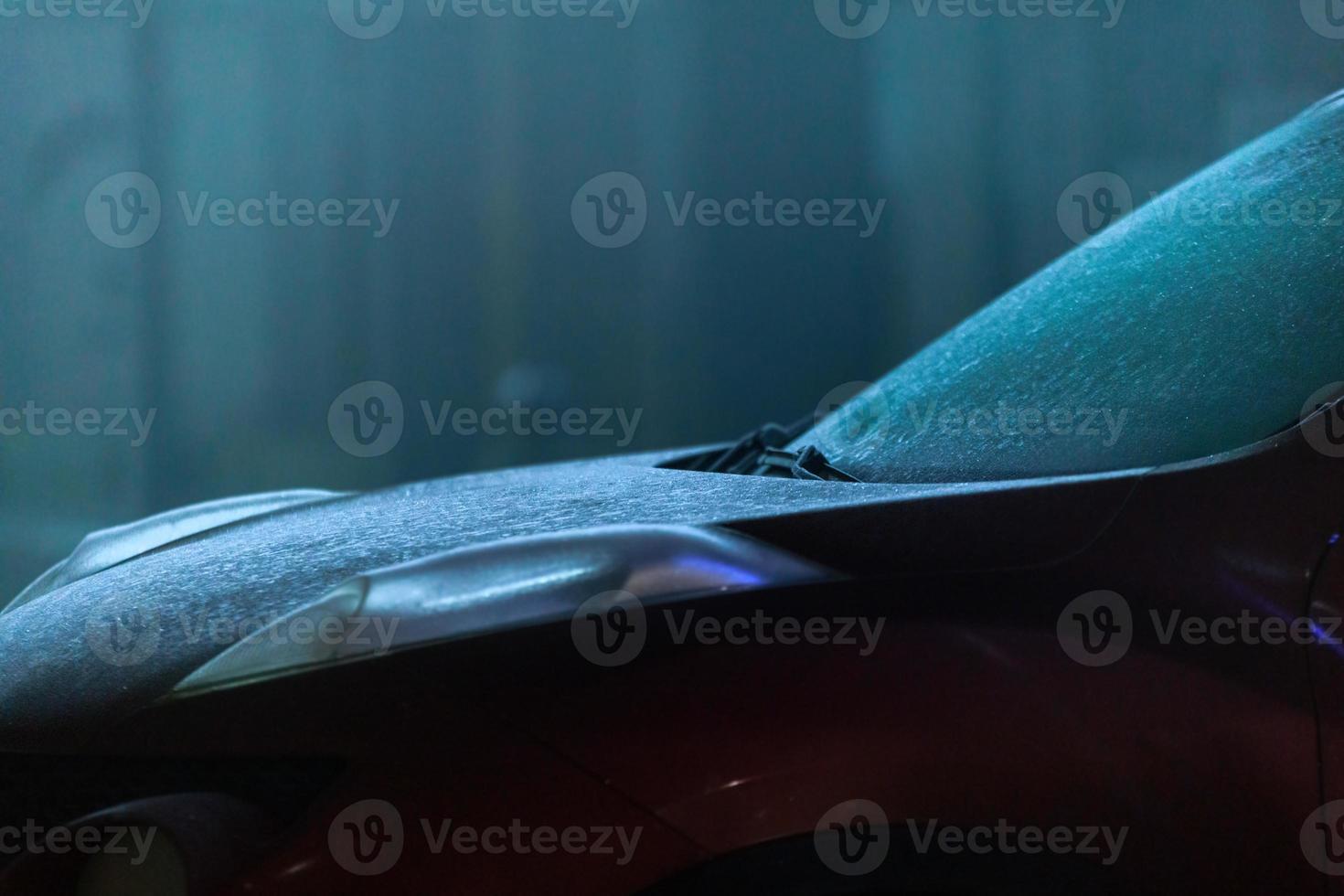 close-up view of sweaty car at foggy night photo