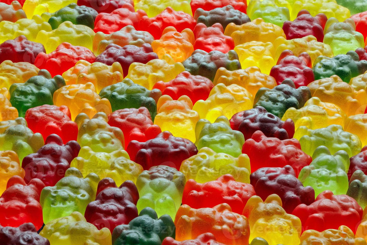full-frame background of colorful jelly bears laid closely on flat surface photo