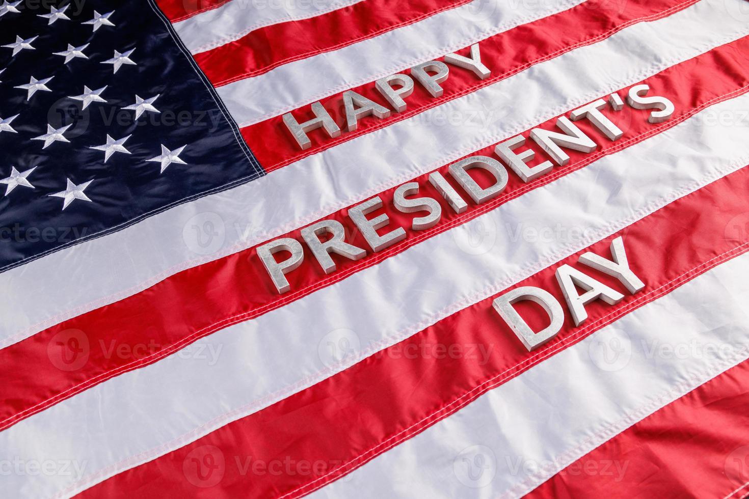 words happy presitdents day laid with real letters on US flag surface photo