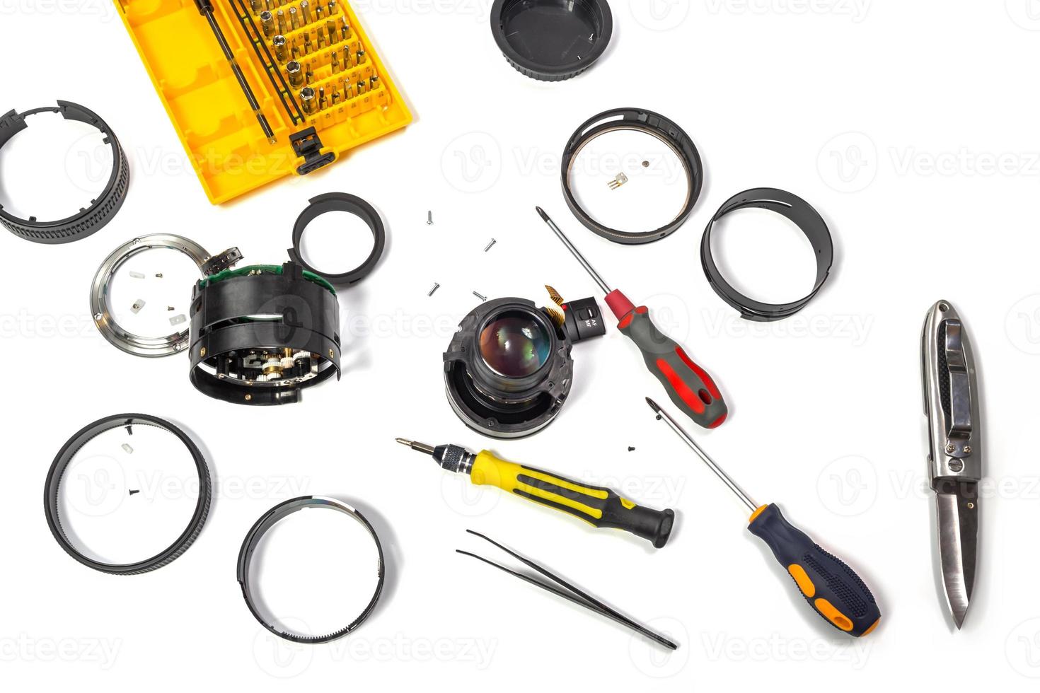 Camera lens repair flat lay view on white background photo