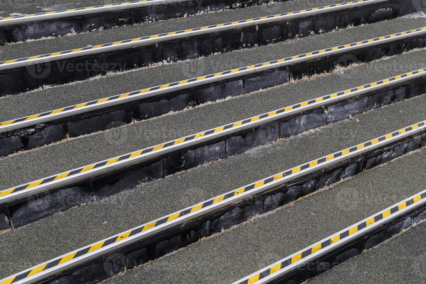 full frame background of roofing felt stairs with striped aluminium corners in diagonal perspective composition photo