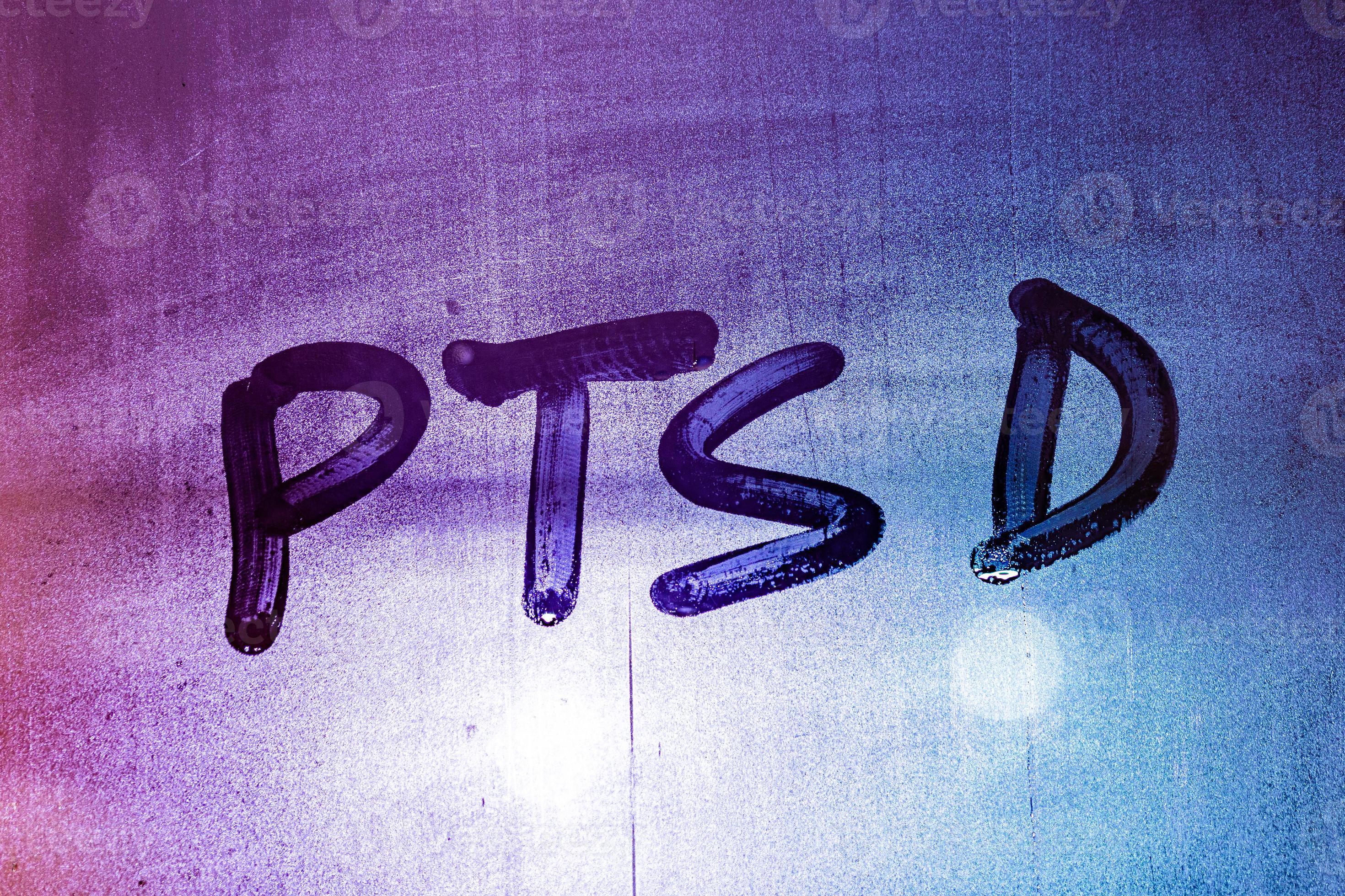 abbreviation ptsd handwritten on night wet window glass 12632338 Stock