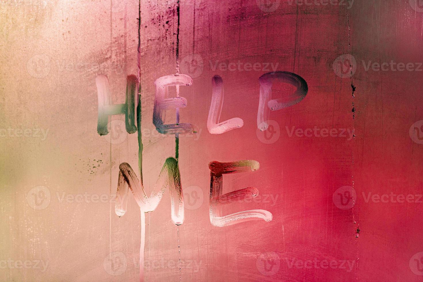 words help me handwritten on night wet window glass with red color gradient photo