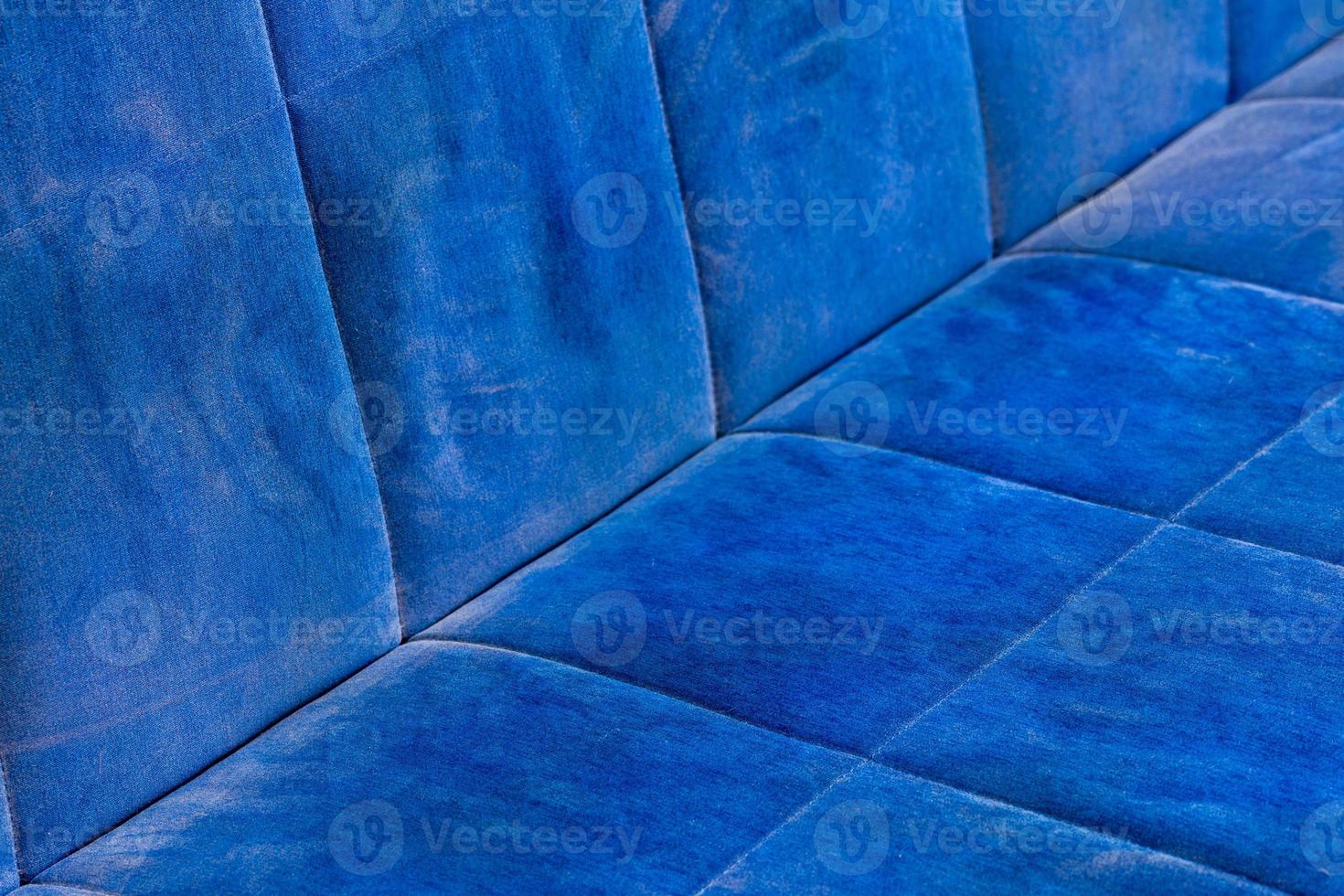 dusty blue sofa surface with palm prints closeup with selective focus photo