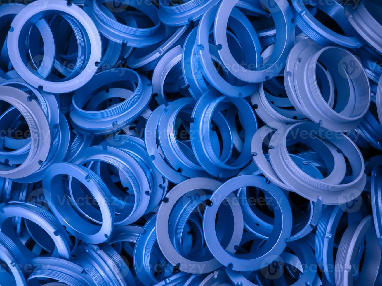 an abstract background of blue phantom blue color coated metal ring parts photo