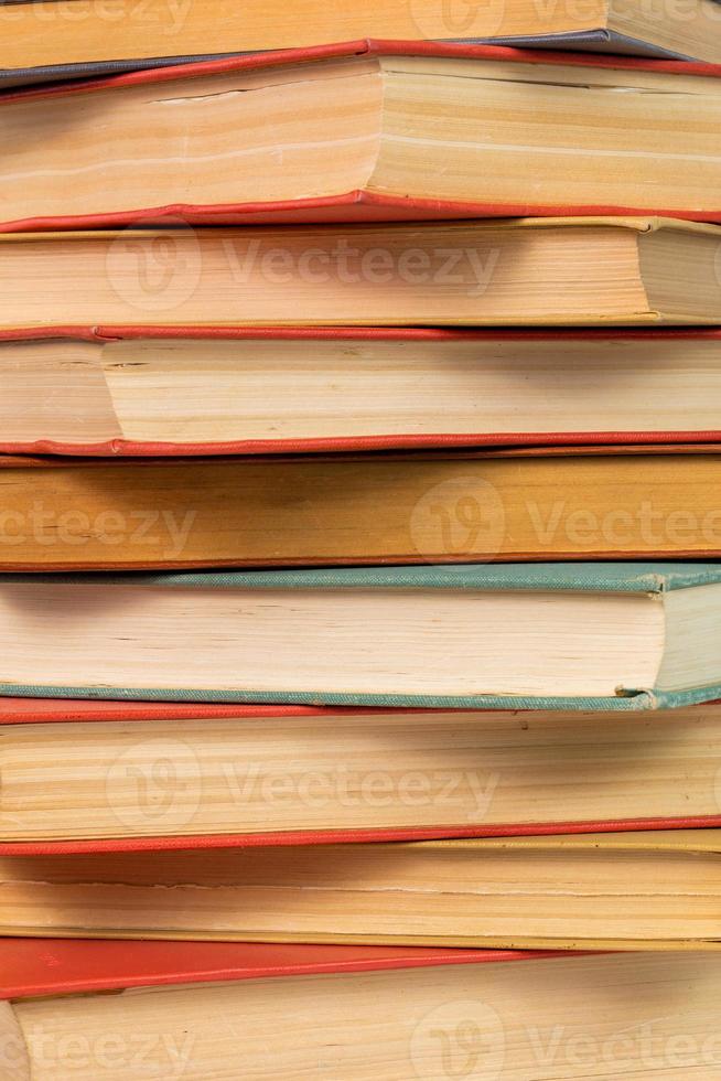 abstract books background - old red and muted green ones in a vertical stack photo
