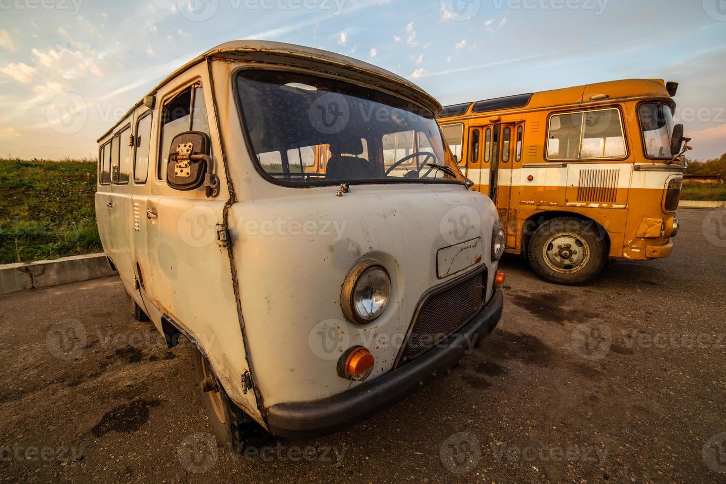 old soviet minibus on rustic summer evening parking ultra wide angle photo