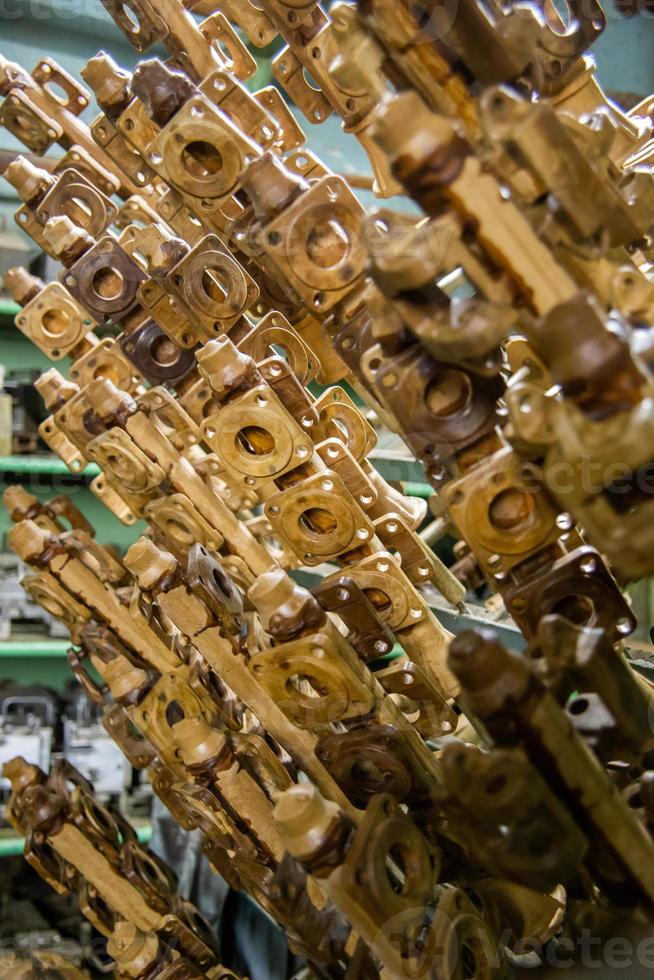 industrial lost wax models on sprue waiting for shell making, close-up with selective focus photo