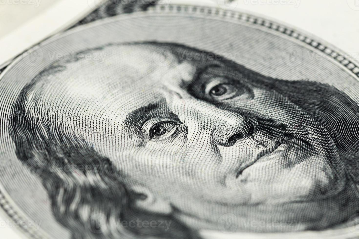 A close view of boring portrait of Ben Franklin of old one hundred us dollar photo