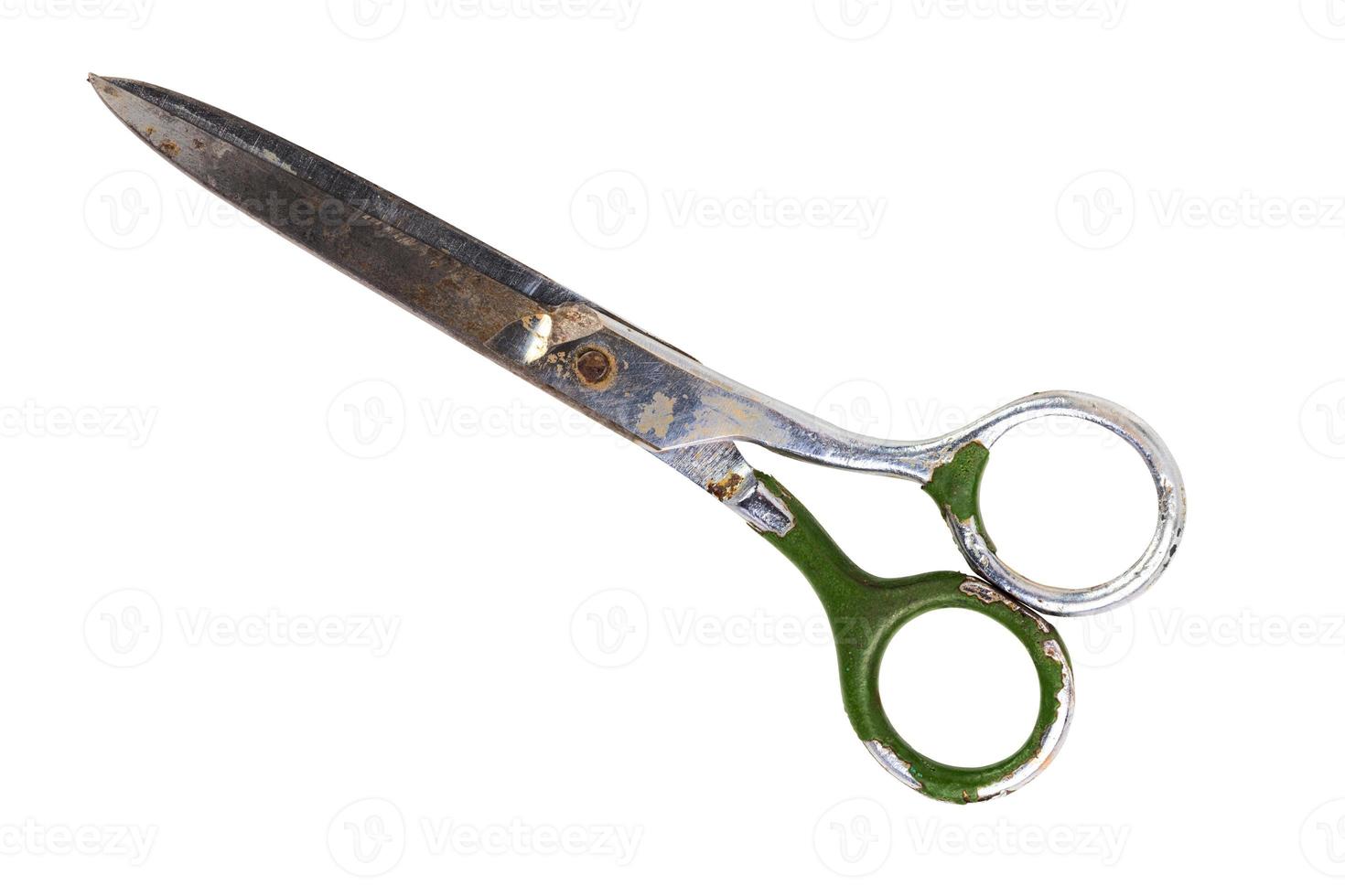 Single old soviet scissors isolated on white background. Closed. photo