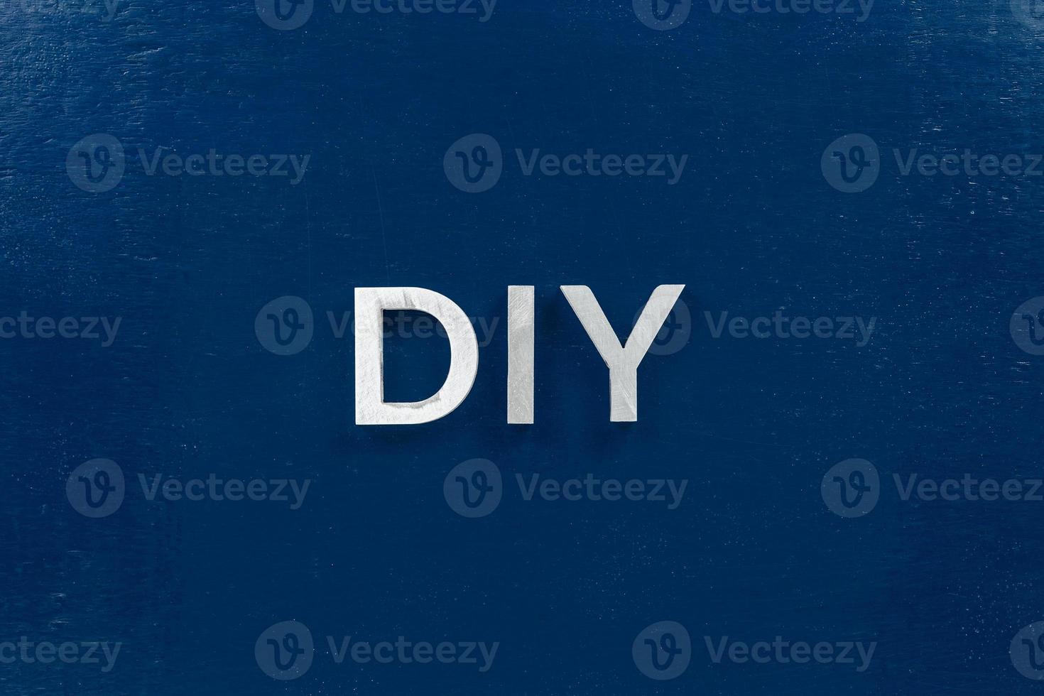 the abbreviation diy do it yourself laid with aluminium letters