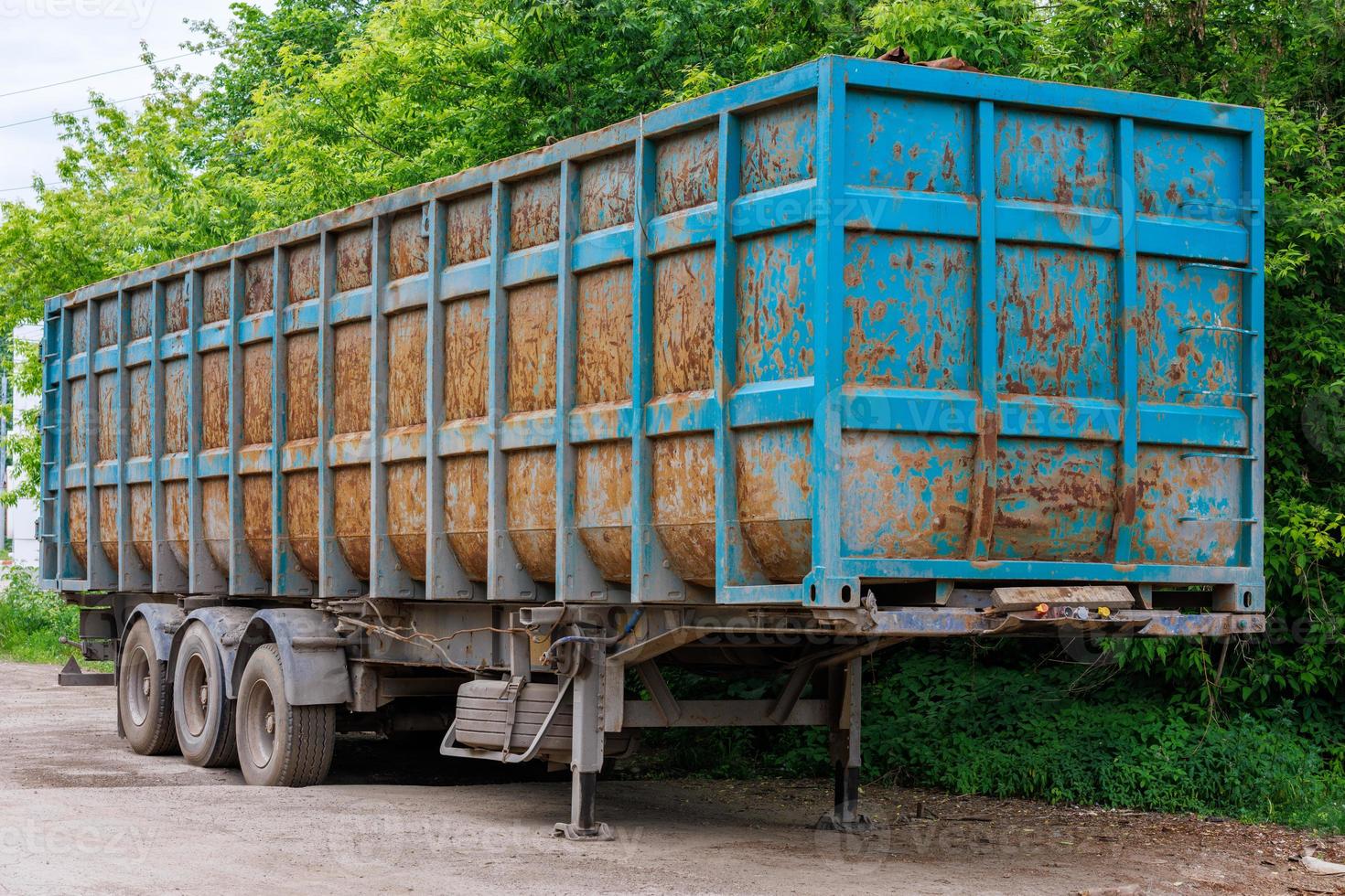 detached rusted trailer for scrap metal, reinforced photo