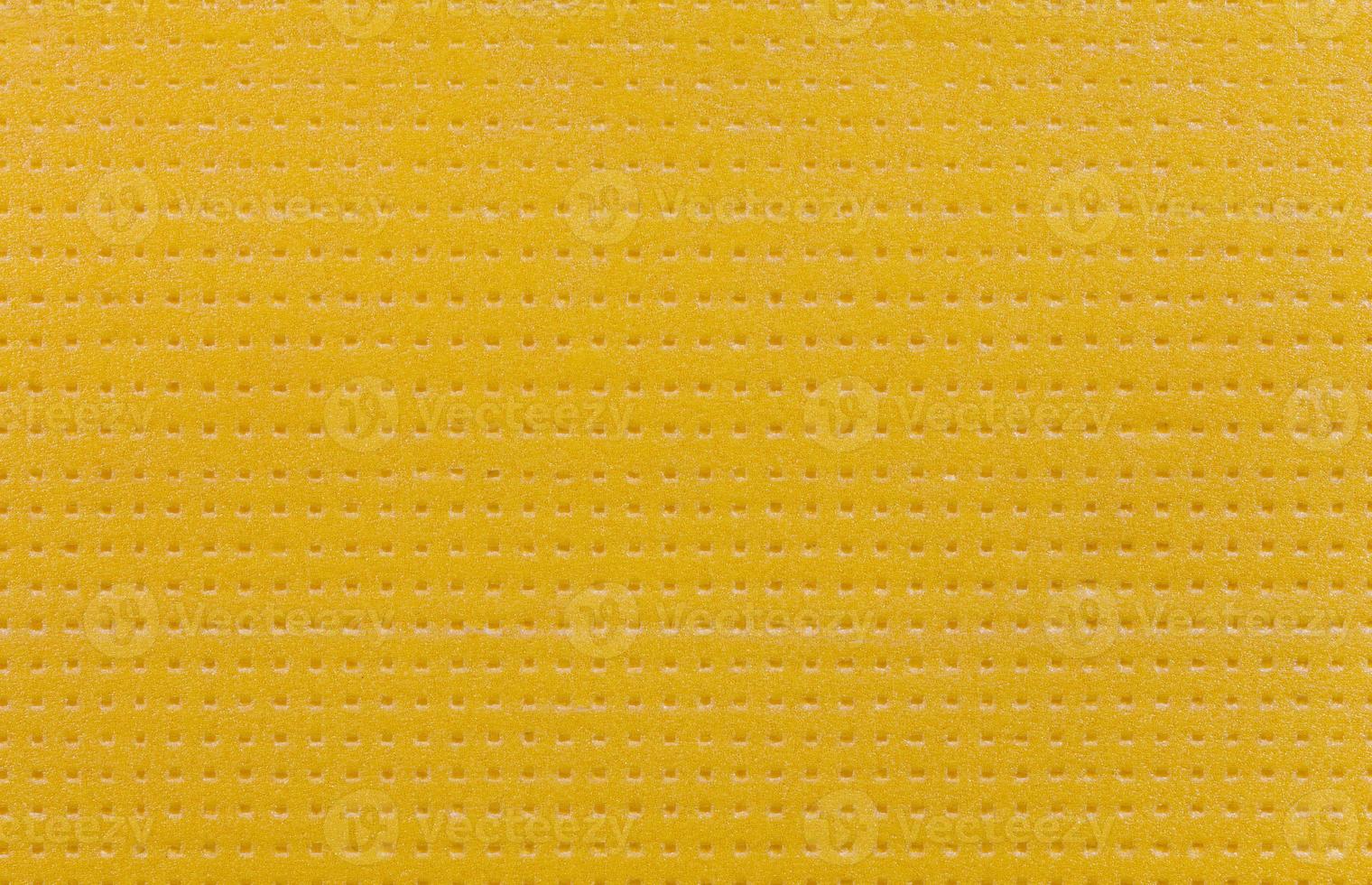 texture and background of sheet of hard yellow styrofoam photo