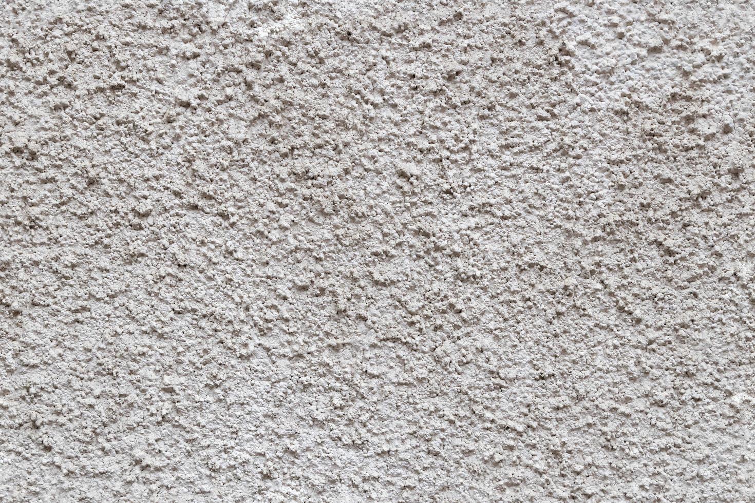 seamless texture and full frame background of rough grey plaster finish