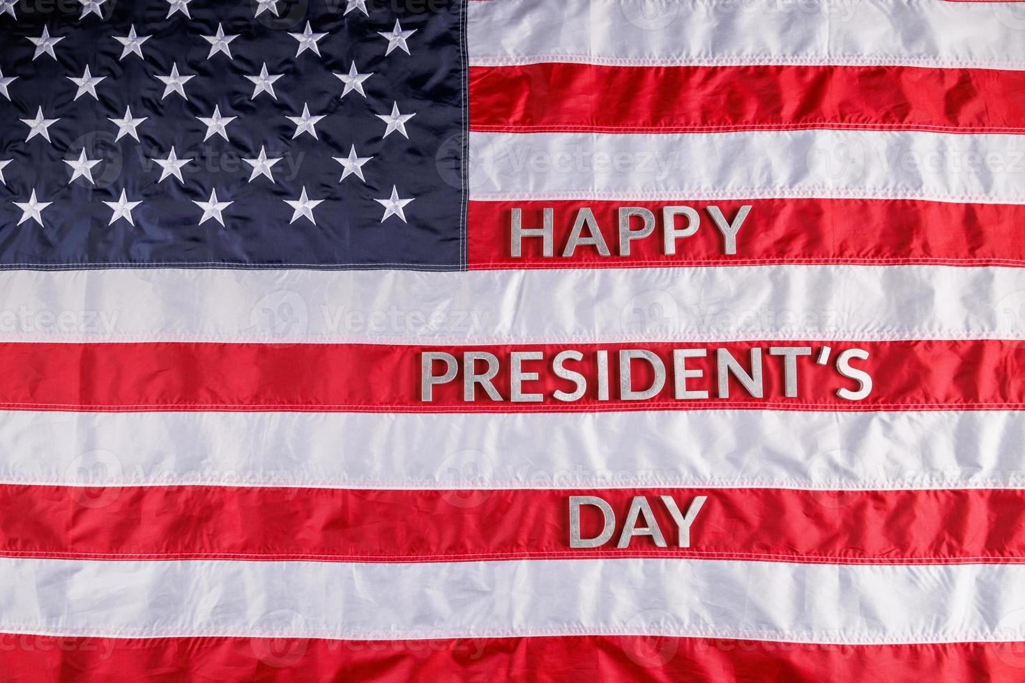 words happy presitdents day laid with real letters on US flag surface photo