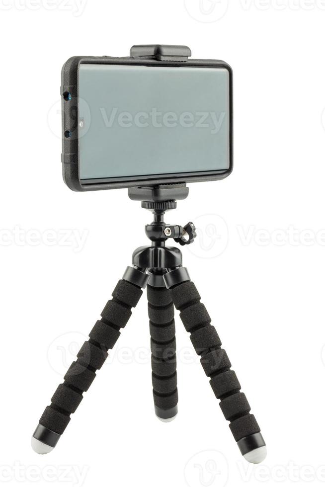 black cellphone in rugged rubber protective cover on small flexible tripod isolated on white photo