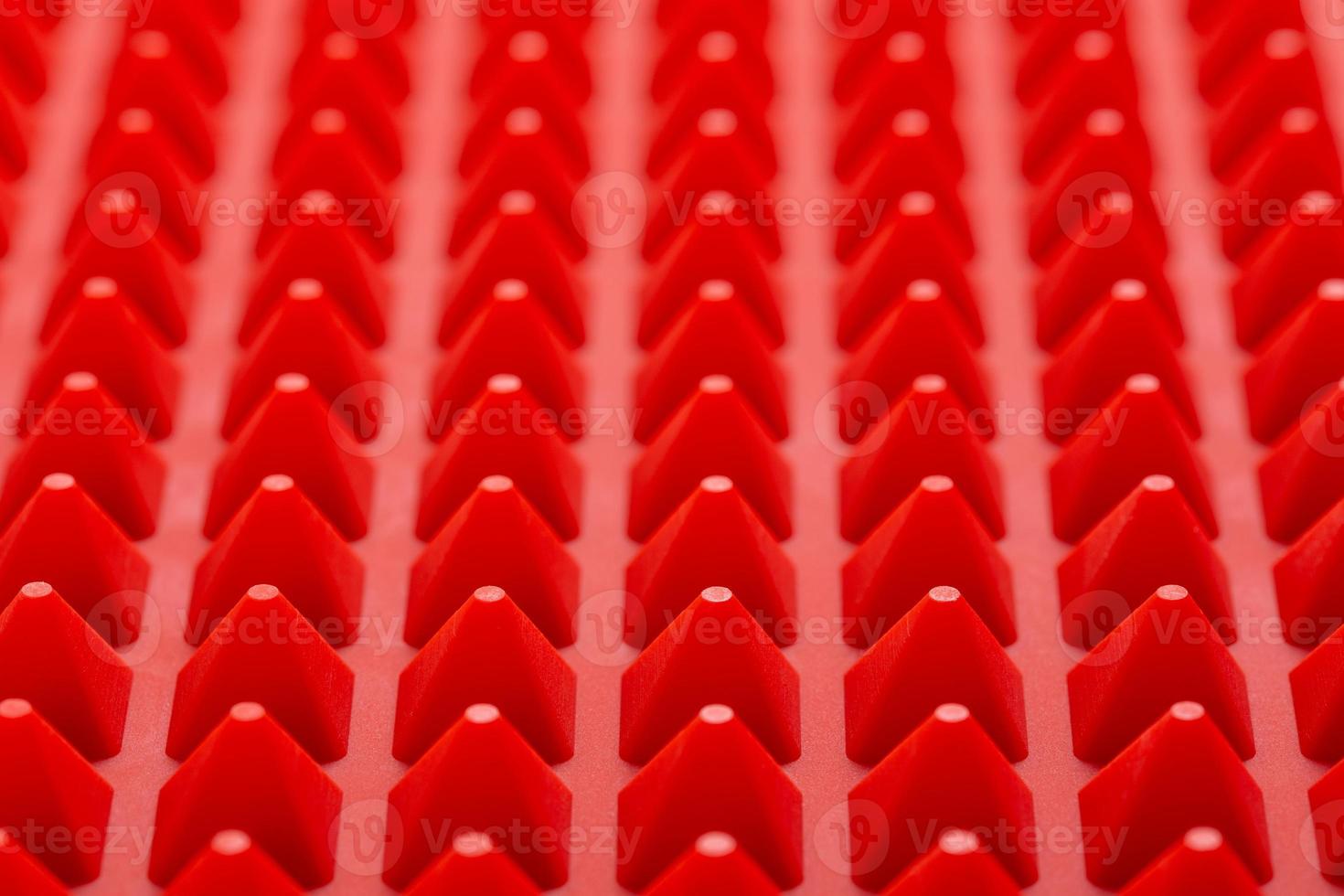 abstract red silicone pyramids mat close-up background photo