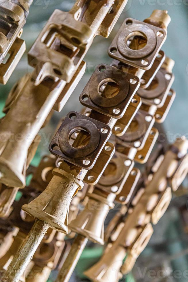 industrial lost wax models on sprue waiting for shell making, close-up with selective focus photo
